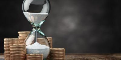 Golden coins and hourglass clock. Return on investment, deposit, growth of income and savings, time is money concept. 3d illustration