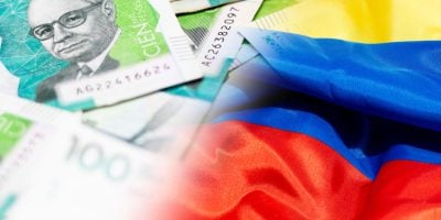 Close-up composition of Colombian 100,000-peso bills with the Colombian flag, representing the national economy, inflation, and Colombia’s financial situation. National minimum wage